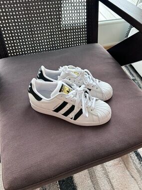 adidas Woman’s White & Black Superstar Sneakers